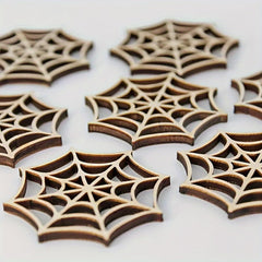 Wooden spider web cutouts on a white background