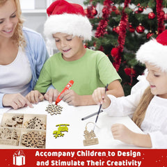 Two children wearing Santa hats and a woman sitting at a table with Christmas decorations and craft materials.
