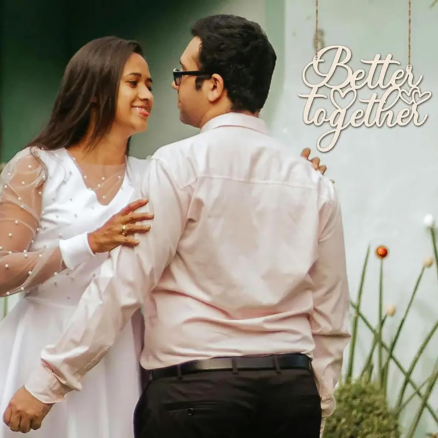 Couple embracing with 'Better Together' text in a natural setting