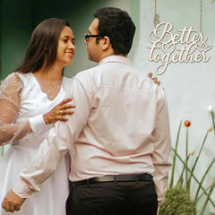 Couple embracing with 'Better Together' text in a natural setting