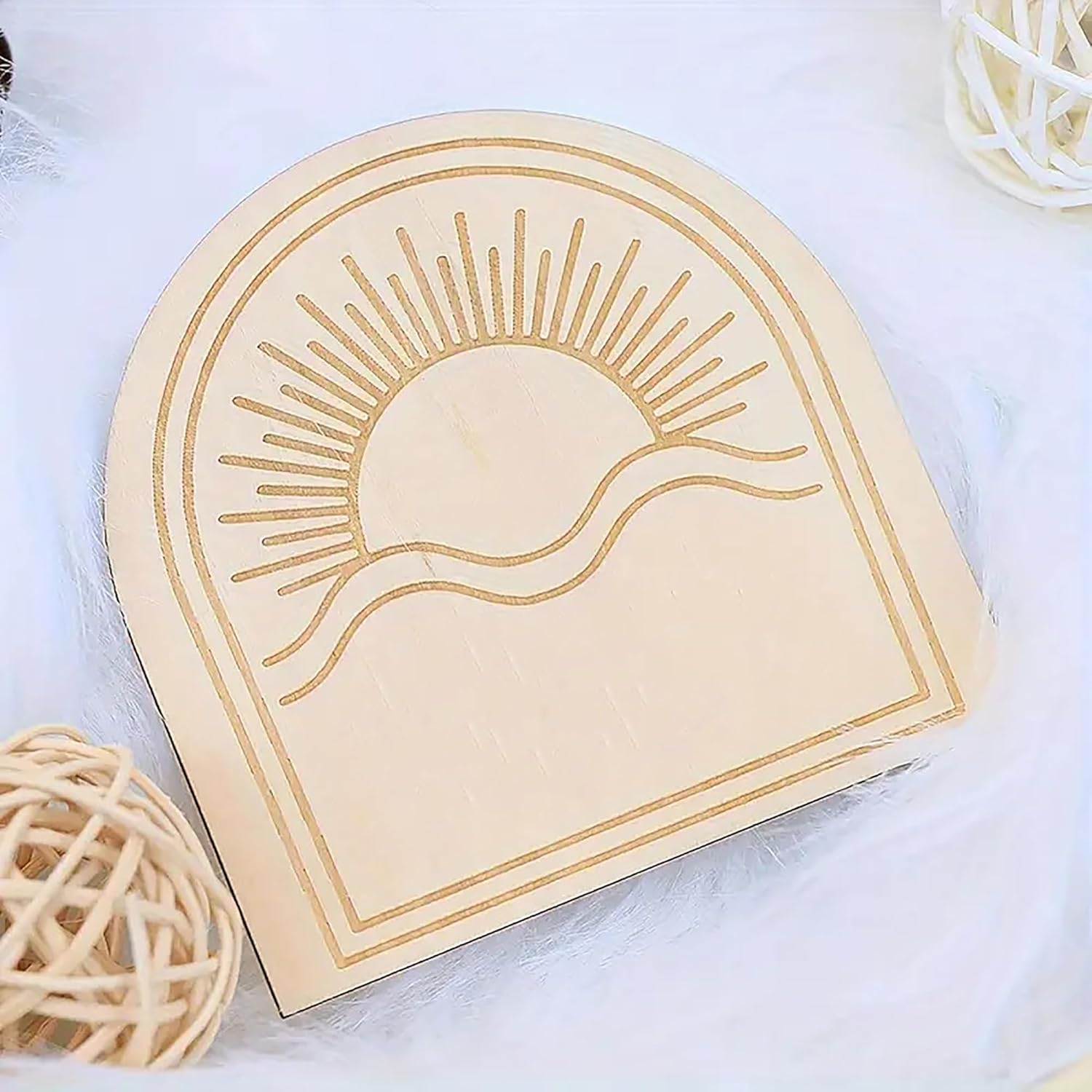 Decorative wooden box with sun design on a white background