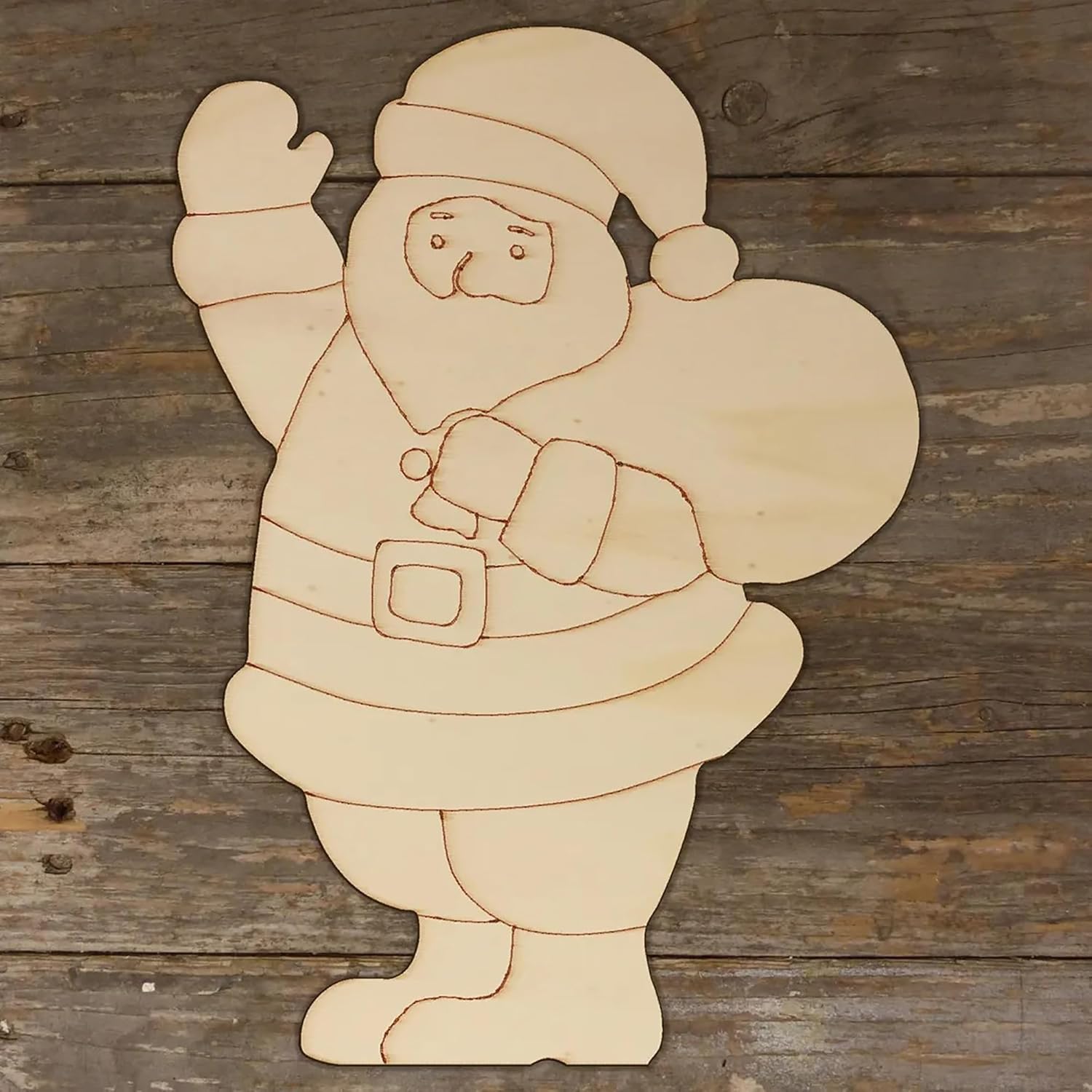 Wooden cutout of a Santa Claus figure on a wooden background