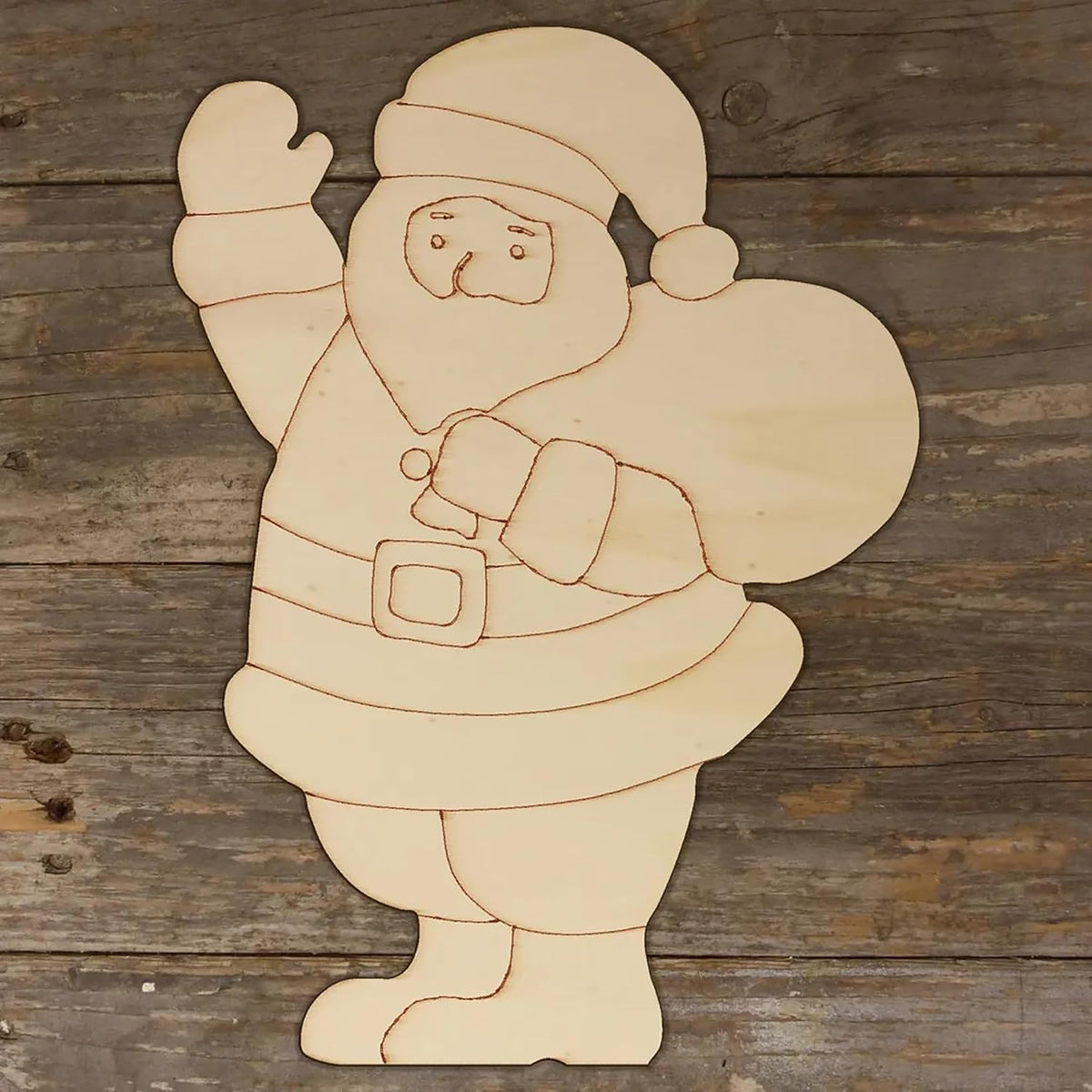 Wooden cutout of a Santa Claus figure on a wooden background