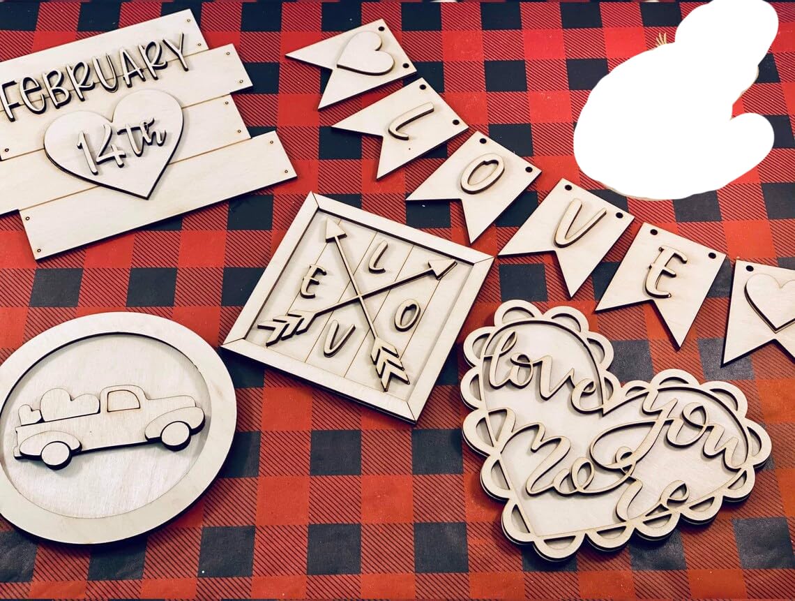 Wooden decorative items with 'LOVE' and other inscriptions on a red and black checkered background