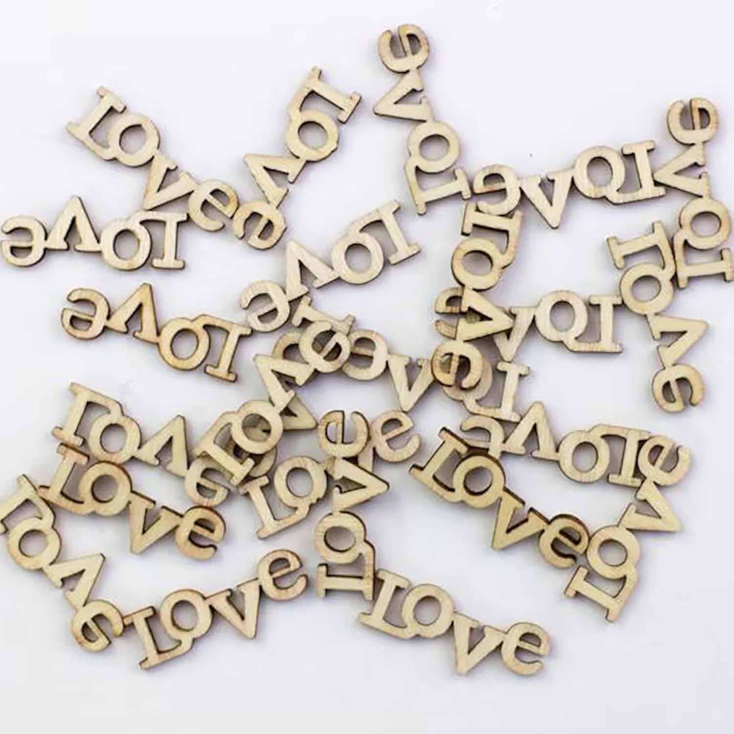Wooden letters spelling 'LOVE' on a white background