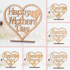 Wooden heart-shaped signs with 'Happy Mothers Day' and personalized names on a blurred background.