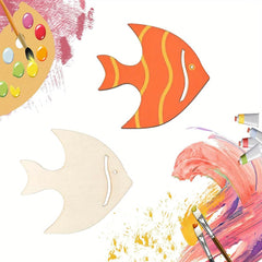 Decorative fish shapes with paint palette, brushes, and paint splashes on a white background