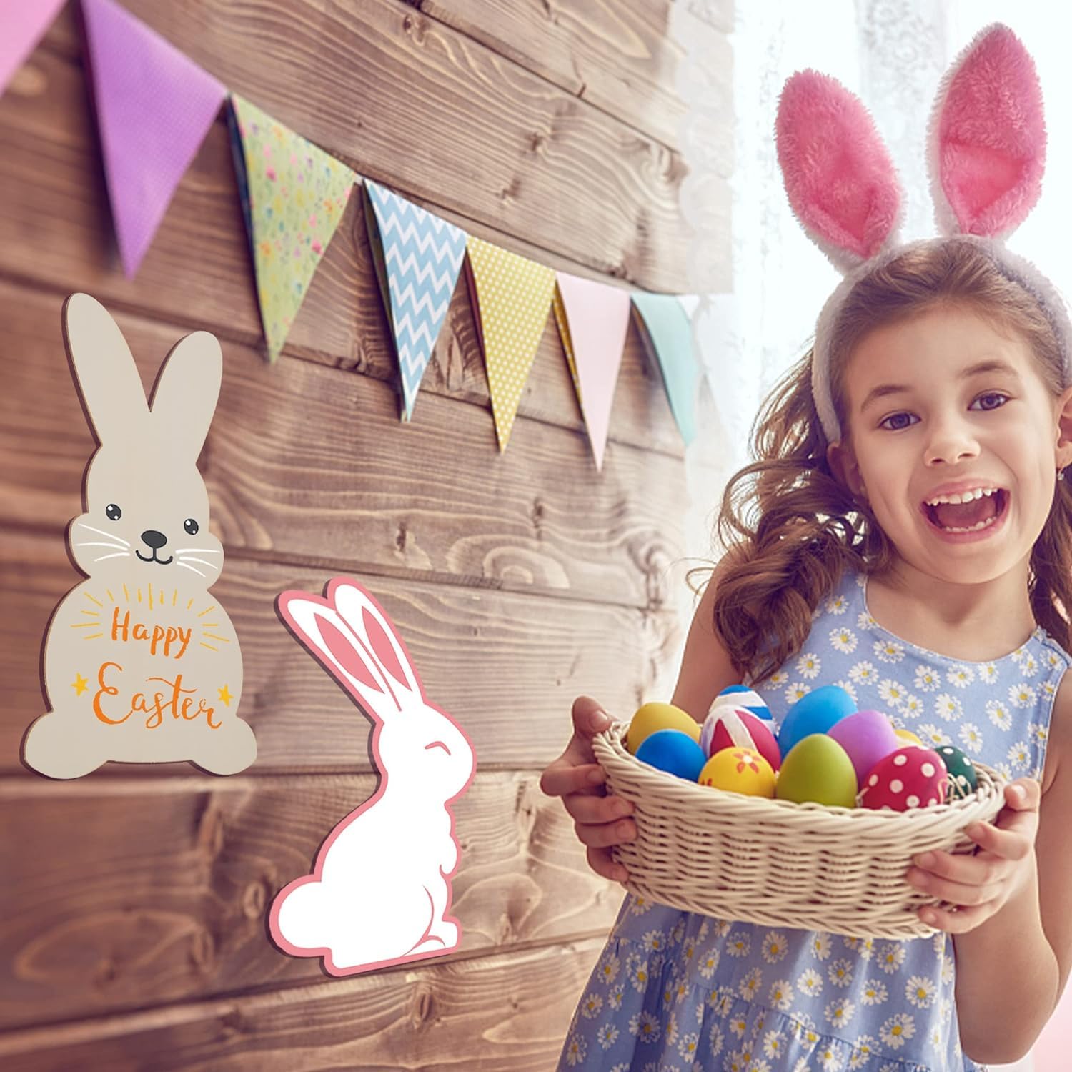 Child wearing bunny ears holding a basket of Easter eggs with decorative bunnies and flags in the background.