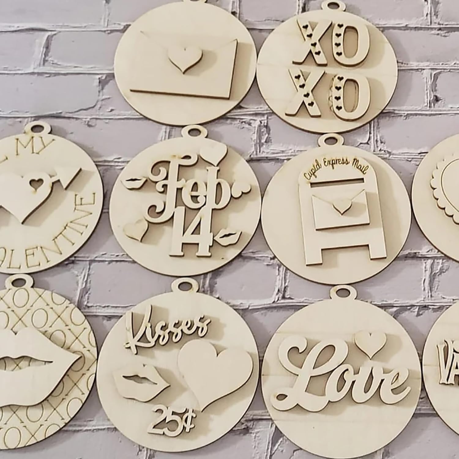 Decorative wooden ornaments with various designs and text on a brick wall background