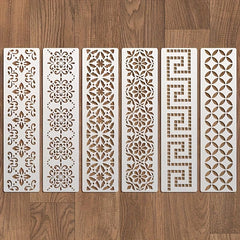 Set of six decorative wall panels with intricate patterns on a wooden floor.