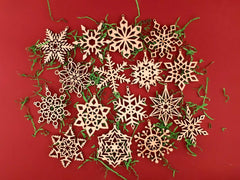 Wooden snowflake ornaments on a red background