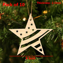 Wooden star ornament with cut-out design hanging on a Christmas tree.