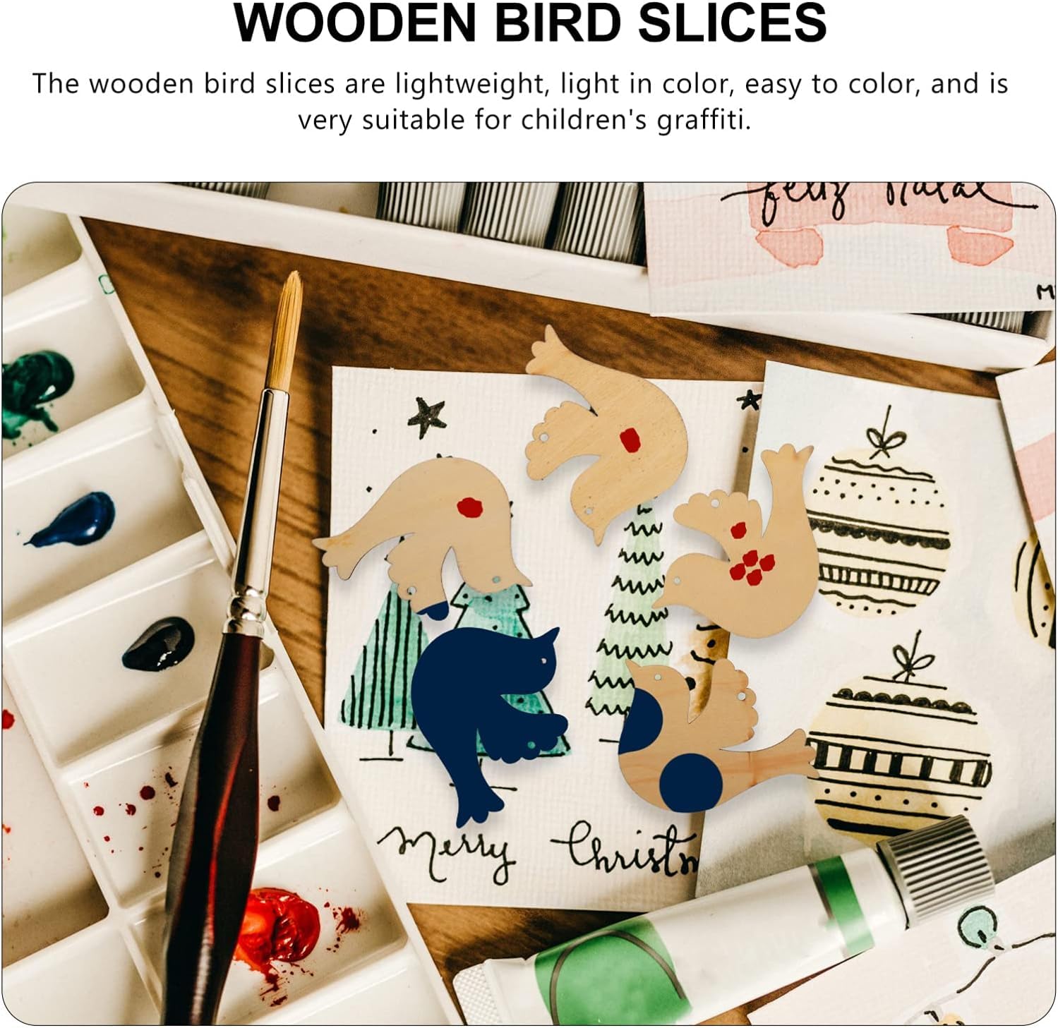 Wooden bird slices on a piece of paper with a paintbrush and paint palette.