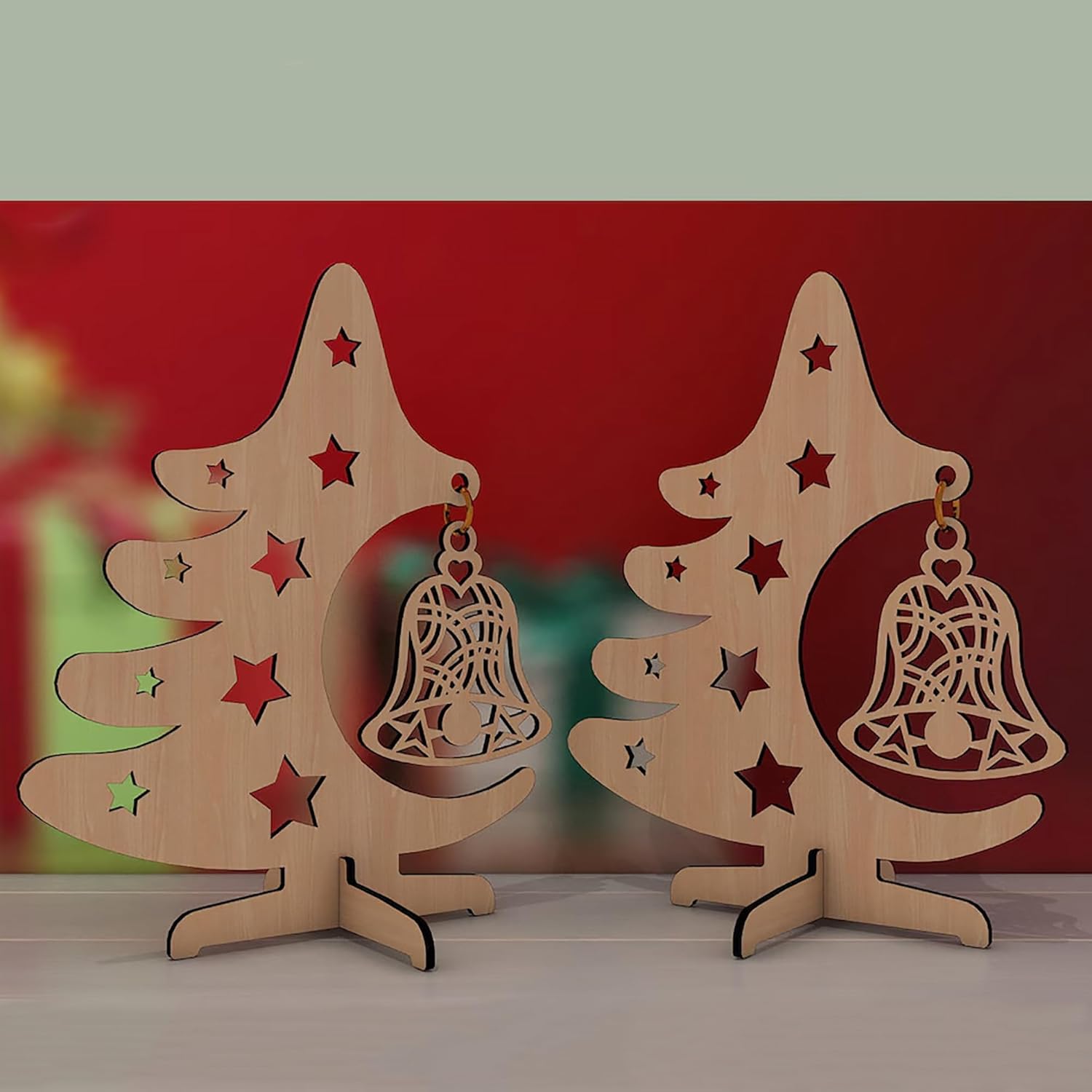Two wooden Christmas tree decorations with bells on a red background
