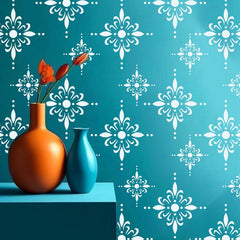 Two vases with flowers on a teal surface with white floral patterns