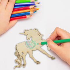 Hand coloring a wooden unicorn with colored pencils on a white background