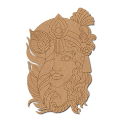 Cardboard cutout of a decorative face design with intricate patterns on a white background