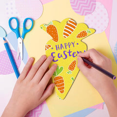 Child's hands coloring a yellow Easter card with blue scissors and markers on a colorful background