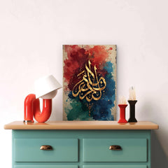 Decorative wall art with Arabic calligraphy on a colorful background above a teal cabinet.