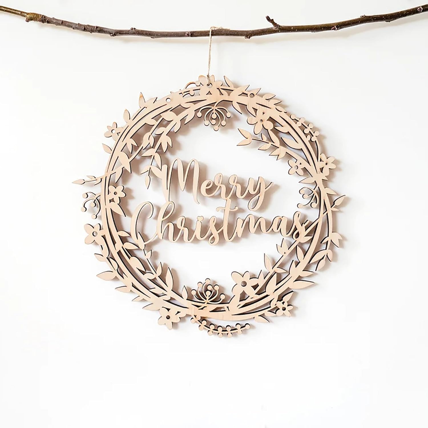Wooden wreath ornament with 'Merry Christmas' text on a white background