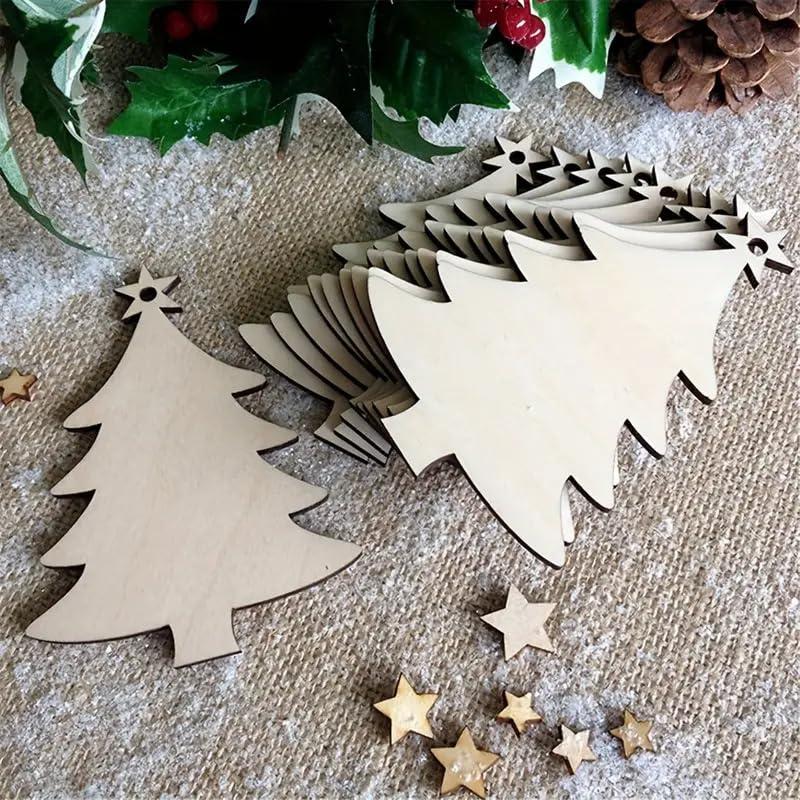 Wooden Christmas tree and star shapes on a textured surface with holly leaves and pine cones.