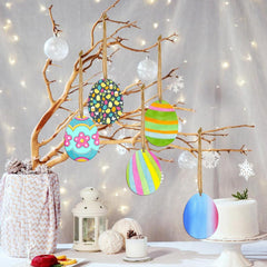 Decorative Easter eggs on a branch with a soft, blurred background