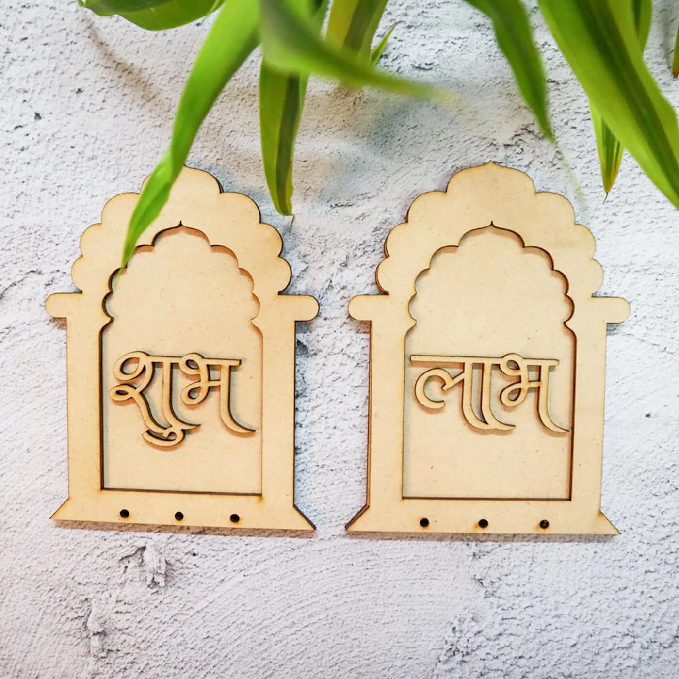 Two wooden decorative pieces with script on a light gray background