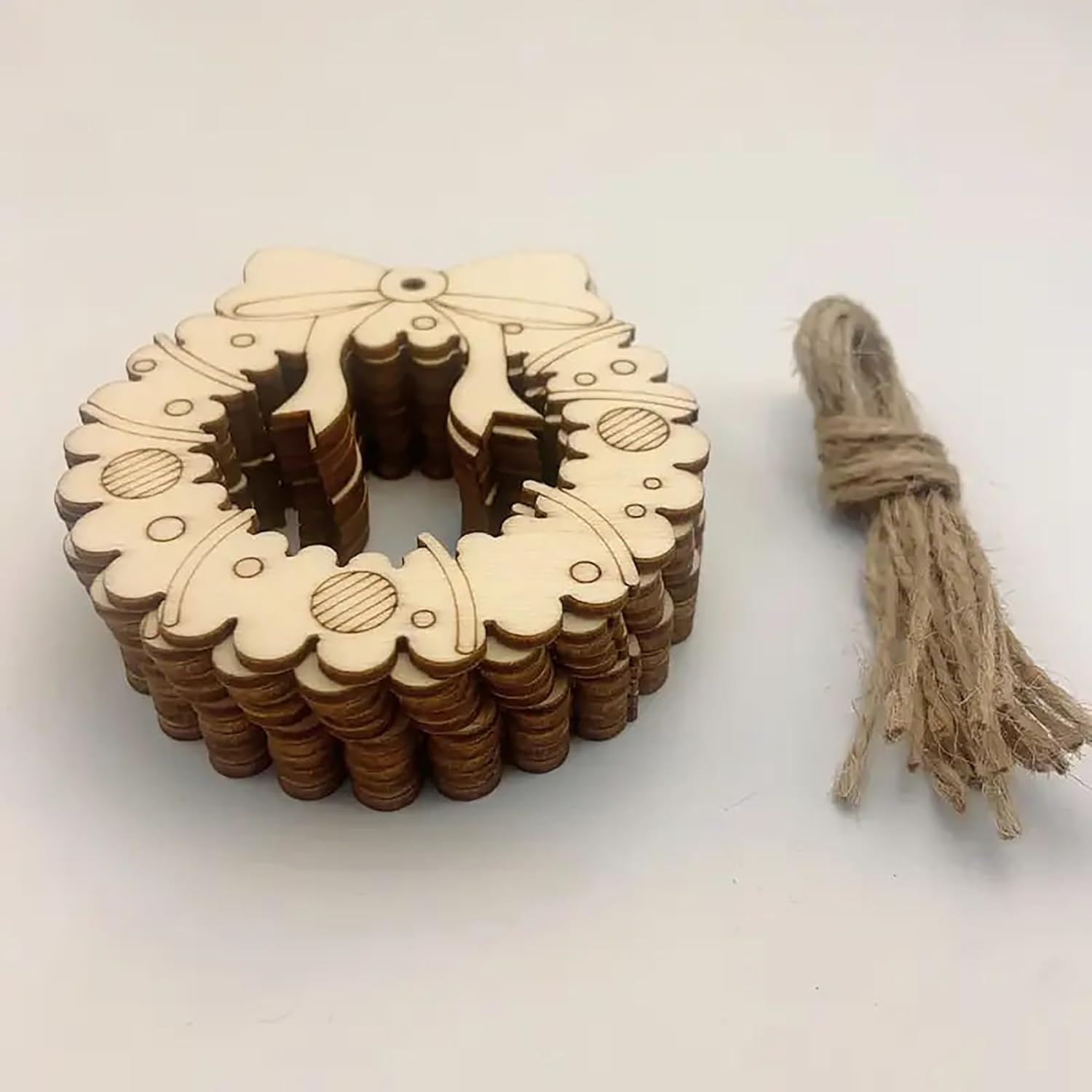 Wooden decorative wreath with string on a white background