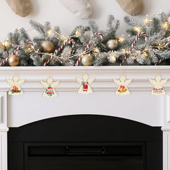 Decorative Christmas mantel with garland, ornaments, and angel banners above a fireplace.