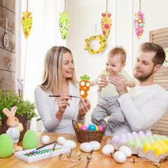 Family engaging in Easter egg decorating activity with colorful eggs and decorations.