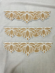 Decorative lace patterns on a gray fabric background