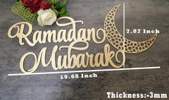 Decorative sign with 'Ramadan Mubarak' text and measurements on a wooden surface.