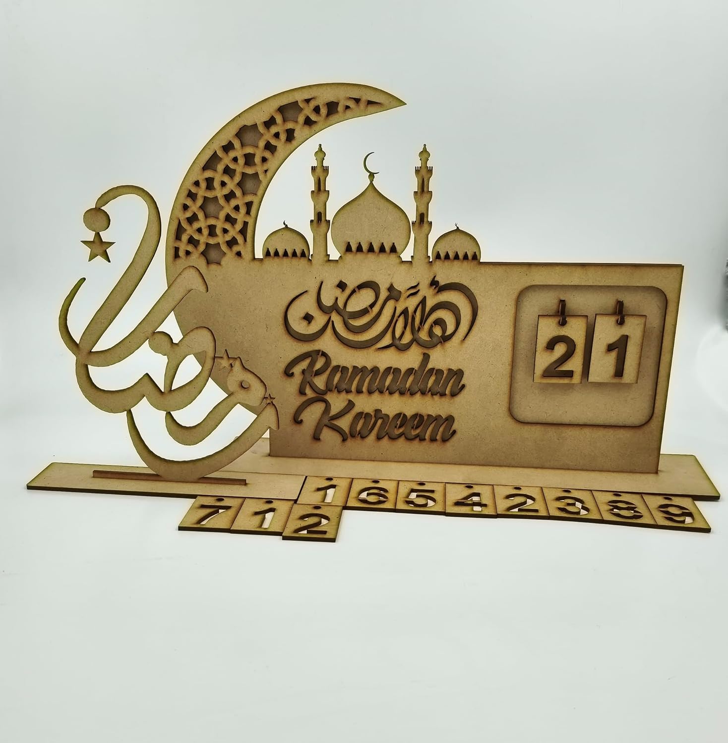 Wooden Ramadan Kareem decorative item with calendar and crescent moon design on a white background
