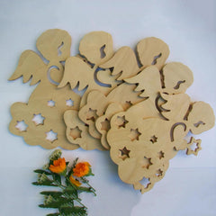 Wooden angel cutouts with star and moon designs on a white background
