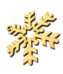 Wooden snowflake ornament on a white background