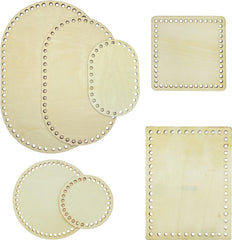Set of wooden coasters with decorative holes on a white background