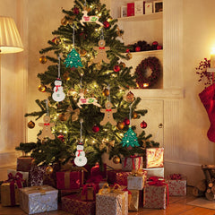 Decorated Christmas tree with ornaments and presents in a cozy living room.