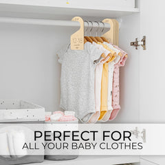 Baby clothes on hangers in a white cabinet with text 'Perfect for all your baby clothes'.