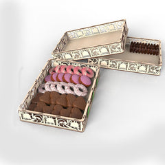 Decorative box with assorted cookies on a white background