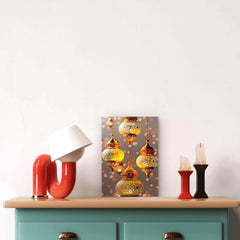 Decorative setup with colorful lamps and a painting on a light-colored wall.