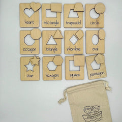Set of wooden shape blocks with labels on a white background
