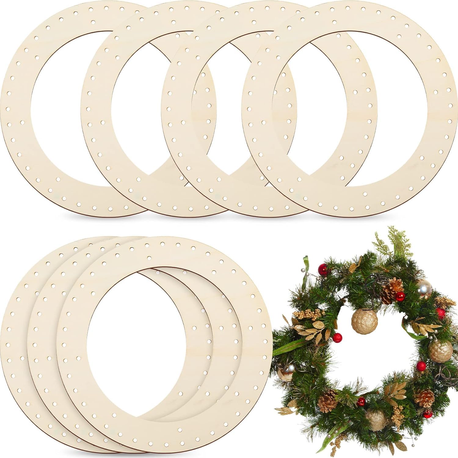 Set of wooden wreath frames with a decorated Christmas wreath on a white background