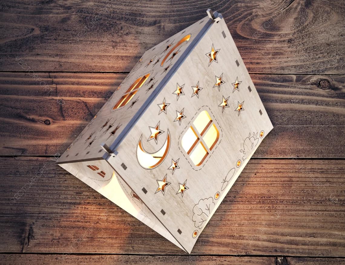Decorative wooden lantern with star and moon patterns on a wooden surface
