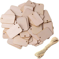 Beige wooden tags with string on a white background