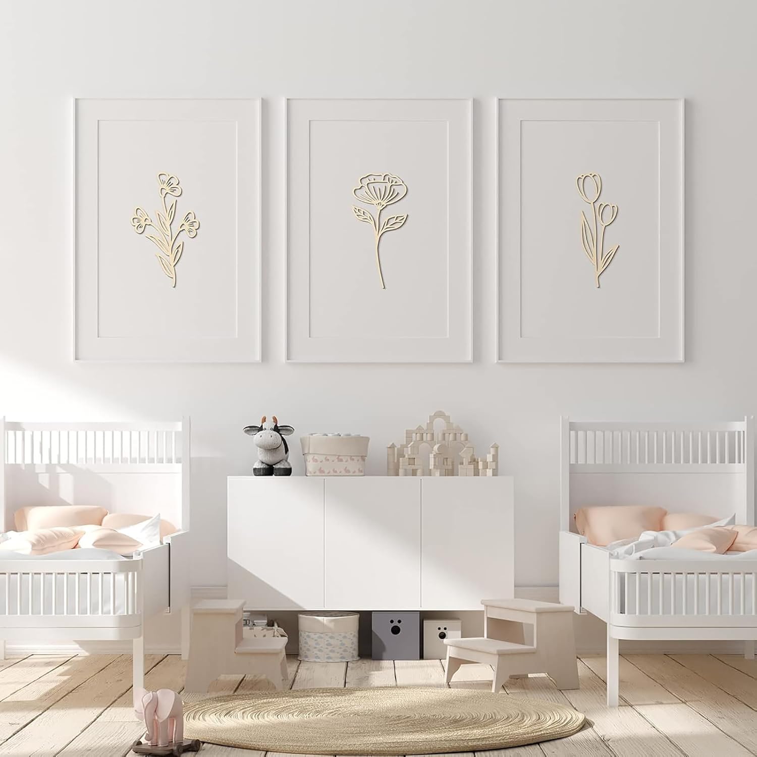 Children's room with white furniture and decorative wall art