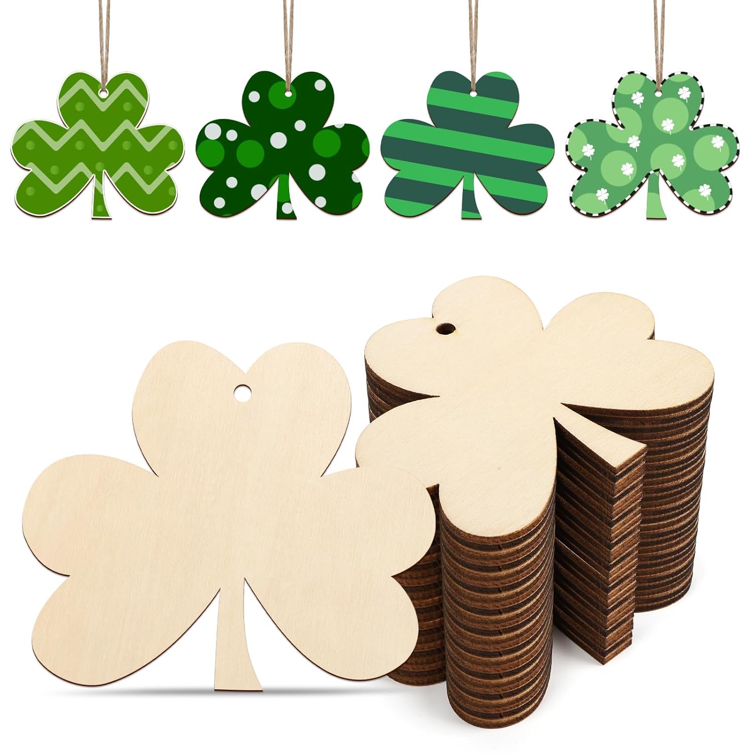 Green shamrock-shaped decorations and wooden shamrock cutouts on a white background
