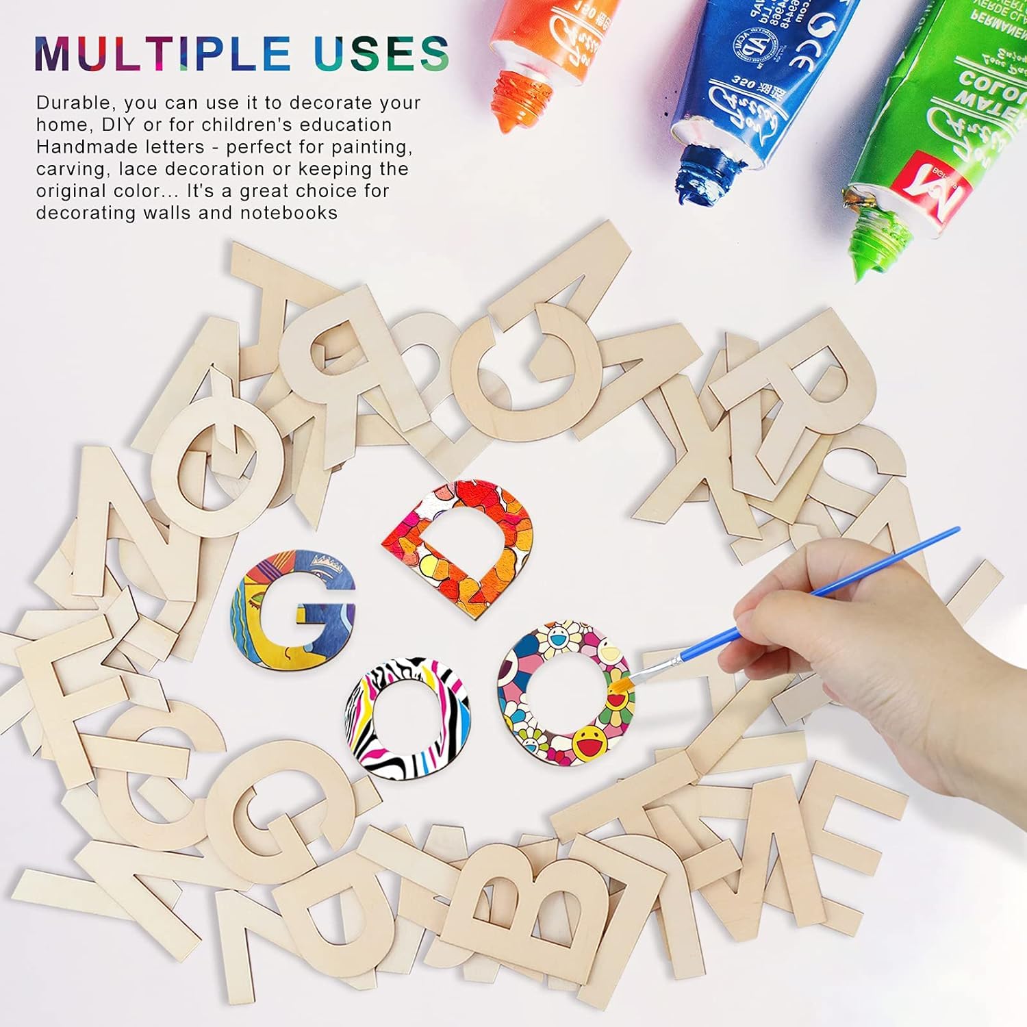 Wooden letters with colorful paint applications and a hand holding a paintbrush on a white background.