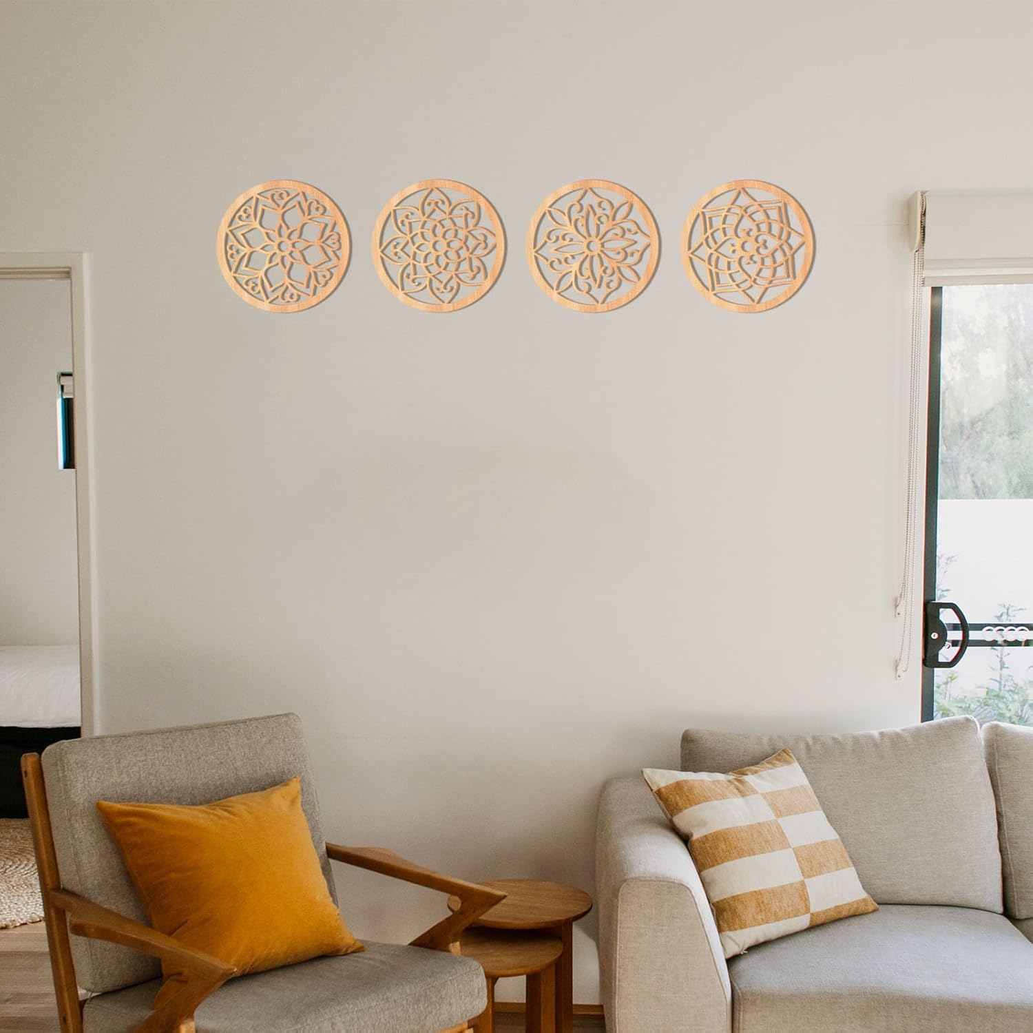 Decorative wall art on a living room wall with a sofa and chair.