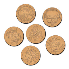 Set of six round cardboard coasters with various designs on a white background