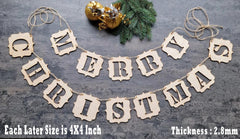 Decorative paper banner with 'Merry Christmas' text on a textured surface.